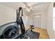 Home gym with weight machine and hardwood floors at 6292 Se 87Th St, Ocala, FL 34472