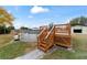 Wooden deck with stairs leading to the pool area at 6292 Se 87Th St, Ocala, FL 34472