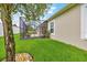 Backyard view of screened-in patio, showcasing a covered outdoor space and lush lawn at 6407 Sw 45Th Ave, Ocala, FL 34474