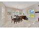 Bright dining room offers a cozy ambiance, complemented by natural light, neutral walls and elegant décor at 6407 Sw 45Th Ave, Ocala, FL 34474