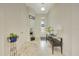 Bright entryway features tiled flooring, a decorative mirror, and console table, creating a welcoming first impression at 6407 Sw 45Th Ave, Ocala, FL 34474