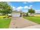 Attractive single-story home offering a manicured lawn, brick-paved driveway, and an attached two-car garage at 6407 Sw 45Th Ave, Ocala, FL 34474
