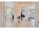 Hallway with views of the bathroom on the left, a bedroom in the center, and the entryway to another room on the right at 6407 Sw 45Th Ave, Ocala, FL 34474