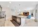 Modern kitchen with a functional island seamlessly integrates with the living room, ideal for entertaining at 6407 Sw 45Th Ave, Ocala, FL 34474