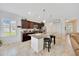 Bright kitchen features granite countertops, stainless appliances, and a functional center island with breakfast bar at 6407 Sw 45Th Ave, Ocala, FL 34474