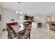 Eat-in kitchen with a granite island and stainless steel appliances that connects seamlessly to the dining and living area at 6407 Sw 45Th Ave, Ocala, FL 34474