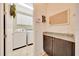 Well-equipped laundry room features modern appliances, granite countertops, and ample storage for convenience at 6407 Sw 45Th Ave, Ocala, FL 34474