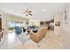 Open concept living room seamlessly connects to the kitchen and outdoor space, perfect for modern living at 6407 Sw 45Th Ave, Ocala, FL 34474