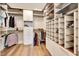 Organized walk-in closet with custom shelving and hanging rods for efficient storage at 6407 Sw 45Th Ave, Ocala, FL 34474