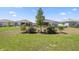 Spacious backyard featuring manicured landscaping and ample green space at 7682 Sw 89Th Ct, Ocala, FL 34481
