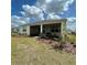 Well-kept backyard with covered patio, perfect for outdoor living at 7682 Sw 89Th Ct, Ocala, FL 34481