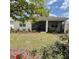 Well-maintained backyard features a screened lanai and manicured landscaping at 7682 Sw 89Th Ct, Ocala, FL 34481