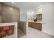 Elegant bathroom featuring a walk-in shower with glass surround and dual vanity with modern fixtures at 7682 Sw 89Th Ct, Ocala, FL 34481