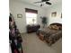 Comfortable bedroom with neutral carpeting, window and ceiling fan at 7682 Sw 89Th Ct, Ocala, FL 34481