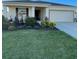 Single-story home with landscaped yard and two-car garage at 7682 Sw 89Th Ct, Ocala, FL 34481