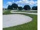 Golf course view showcasing sand traps and manicured greens at 7682 Sw 89Th Ct, Ocala, FL 34481