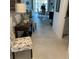 Inviting hallway with neutral tile flooring leading to the dining and living areas at 7682 Sw 89Th Ct, Ocala, FL 34481