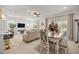 Open-concept living and dining area featuring bright decor and ample seating, perfect for entertaining at 7682 Sw 89Th Ct, Ocala, FL 34481