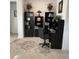 Home office featuring built-in bookshelves, desk, chair, decorative rug, and ample natural light at 7682 Sw 89Th Ct, Ocala, FL 34481