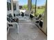 Enclosed patio with stylish white wicker seating and a view of the outdoors at 7682 Sw 89Th Ct, Ocala, FL 34481