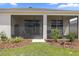 Landscaped backyard features a screened in porch for outdoor enjoyment at 7682 Sw 89Th Ct, Ocala, FL 34481