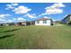 Large backyard, grassy area, and view of neighborhood homes at 8456 Sw 52Nd Lane Rd, Ocala, FL 34481