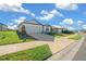 House exterior showing a driveway and well-maintained lawn in a residential neighborhood at 8456 Sw 52Nd Lane Rd, Ocala, FL 34481