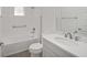 Bathroom with bathtub, toilet, vanity, and wood-look floors at 10210 Sw 99Th Ln, Ocala, FL 34481