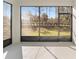 Screened porch with view of backyard and trees at 10210 Sw 99Th Ln, Ocala, FL 34481