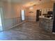 Elegant dining area with a chandelier, tile flooring, and a view of the kitchen at 113 Guava Ter, Ocklawaha, FL 32179