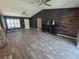Bright living room showcasing modern design with wood floors and a decorative fireplace at 113 Guava Ter, Ocklawaha, FL 32179