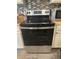 Close-up of a stainless steel appliance with modern knobs and digital display at 113 Guava Ter, Ocklawaha, FL 32179