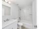 Clean bathroom with white vanity, tub and marble shower at 127 Marion Oaks Golf Way, Ocala, FL 34473