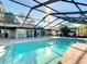 Inviting screened-in pool with patio and view at 21343 Sw Plantation St, Dunnellon, FL 34431