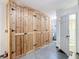 Large storage room with built-in wooden cabinets at 21343 Sw Plantation St, Dunnellon, FL 34431