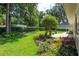 Landscaped backyard with green lawn at 2215 Se Spring Hill Ct, Ocala, FL 34471