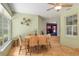 Sunroom breakfast nook with wicker chairs and view at 2215 Se Spring Hill Ct, Ocala, FL 34471