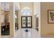 Open and airy entryway with double doors and view to living room at 2215 Se Spring Hill Ct, Ocala, FL 34471