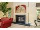 Elegant fireplace with arched mirror above at 2215 Se Spring Hill Ct, Ocala, FL 34471