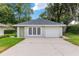 Detached garage with a single car door and windowed room at 2215 Se Spring Hill Ct, Ocala, FL 34471