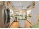 Galley style kitchen with stainless steel appliances and green countertops at 2215 Se Spring Hill Ct, Ocala, FL 34471