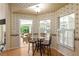 Bright kitchen nook with glass table and chairs, perfect for casual dining at 2215 Se Spring Hill Ct, Ocala, FL 34471