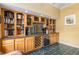 Built-in wet bar with wine rack and granite countertop at 2215 Se Spring Hill Ct, Ocala, FL 34471