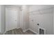 Laundry room with built-in shelving and a door to the outside at 24268 Sw Tiger Lake W Blvd, Dunnellon, FL 34431