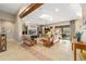 Spacious living room featuring a large TV, comfortable seating, and a beautiful stone accent wall at 2802 Se 28Th St, Ocala, FL 34471