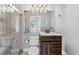 Bathroom featuring a glass shower, modern vanity, and updated lighting at 36323 Piney Ridge Blvd, Fruitland Park, FL 34731