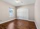 Bedroom with wood floors, window, and closet at 36323 Piney Ridge Blvd, Fruitland Park, FL 34731