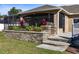 Custom outdoor kitchen with grill, and beautifully landscaped garden create an entertainment space at 36323 Piney Ridge Blvd, Fruitland Park, FL 34731