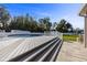 Steps leading up to a large deck around a pool at 36323 Piney Ridge Blvd, Fruitland Park, FL 34731