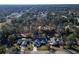 Aerial view of a remodeled house on a tree-lined street at 4216 Se 7Th Pl, Ocala, FL 34471